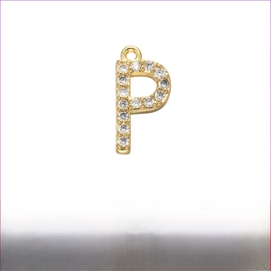Macro view of gold brass letter P pendant with micro paved cubic zirconia and 15mm size details