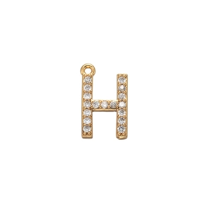 Macro shot of gold-plated letter H pendant featuring sparkling pavé cubic zirconia