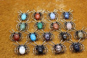 Macro display of assorted spider pendants with 16 natural gemstones and crystal alloys