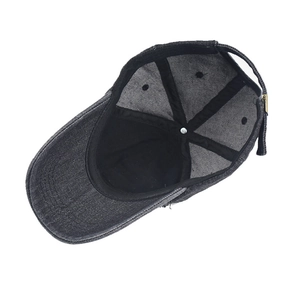 Interior detail of black distressed denim baseball cap featuring sweatband and metal buckle