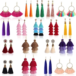 Collection of colorful bohemian tassel earrings in various vibrant tiered silk styles