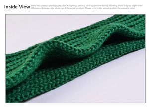 Detail of coarse knit structure and interior texture of a grass green knitted scarf