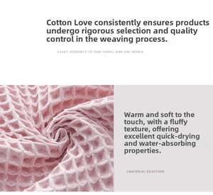 Close-up of pink cotton waffle weave towel showing breathable texture and high absorption
