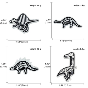 Size and weight details for four distinct dinosaur skeleton enamel pins on white background