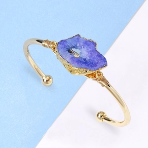 Handmade copper wire wrapped gold cuff bracelet featuring a natural purple druzy agate stone