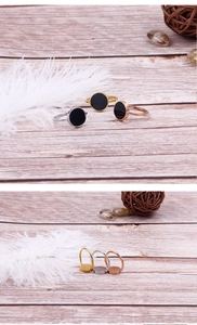 Detailed view of minimalist titanium steel rings in gold, silver, and rose gold finishes