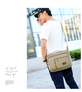 Outdoor model shot of khaki canvas crossbody bag showing side profile and adjustable strap