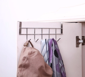 Close-up of stainless steel over-the-door 5-hook rack holding a hat and scarves