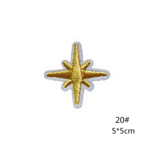 Close-up of a gold star embroidery patch with detailed texture and 5x5cm dimensions