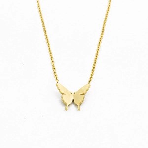 Close-up of golden butterfly necklace with brushed metal finish and cross chain