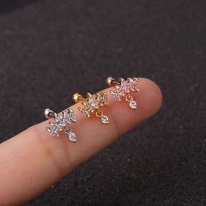 Three crown helix piercings in silver gold and rose gold with marquise cut zircon stones