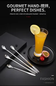 Set of 4 stainless steel long handle spoons for coffee and dessert on minimalist black background