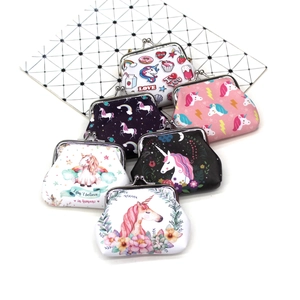 Detail of colorful unicorn coin purses featuring kiss lock closures and canvas textures