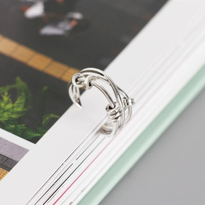 Macro detail of S925 silver multi-layer fidget ring with movable metal beads