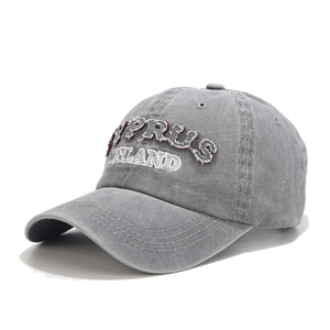 Close-up of vintage washed grey baseball cap with Cyprus Island 3D embroidery detail