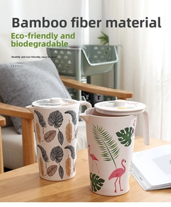 Eco-friendly bamboo fiber water pitchers with tropical leaf and flamingo prints on a wood table
