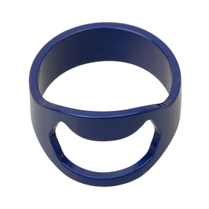 Macro shot of dark blue stainless steel bottle opener ring with smooth finish on white background