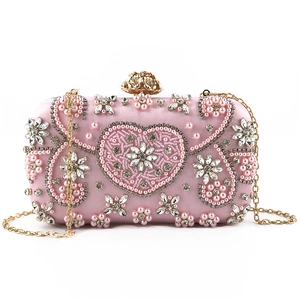 Pink handmade beaded evening bag with pearls, crystals, and gold chain strap