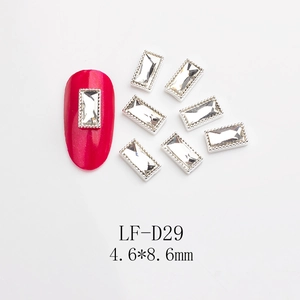 Macro detail of rectangular nail art rhinestones with silver textured metal edges