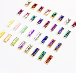 Detailed view of colorful rectangular rhinestones with gold and silver beaded metal edges