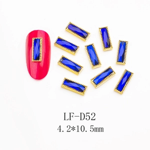 Blue rectangle gemstone nail art studs with gold metal frame on red nail, size 4.2x10.5mm