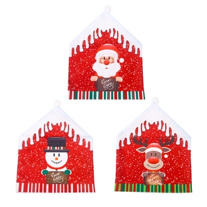 Christmas chair covers featuring Santa, Snowman, and Reindeer with Warm Wishes print