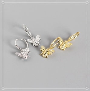 Detailed view of S925 sterling silver bee earrings with fine textures and buckle closure