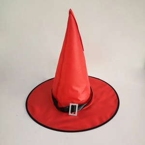 Detail view of red wizard hat featuring a black silk band and silver rhinestone buckle
