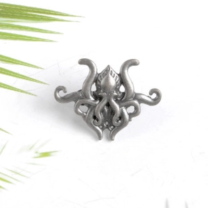 Macro detail of gothic octopus brooch showing intricate zinc alloy relief and tentacles