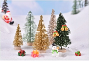 Miniature Christmas landscape set with sisal trees, snowmen and gift boxes in snow