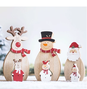Close-up of Nordic wooden Christmas figurines featuring reindeer, snowman and Santa Claus
