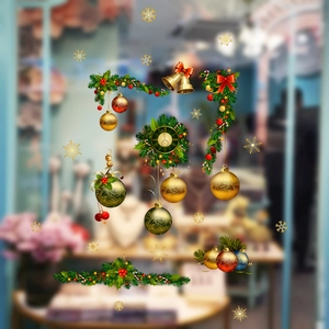 Christmas window decals featuring golden bells, red ornaments and festive holiday wreaths