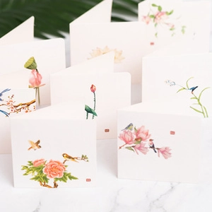 Detail of Chinese style floral greeting cards with gold stamping on marble background