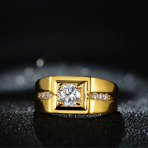 Close-up of a men's gold square ring featuring a large center zircon on a black background