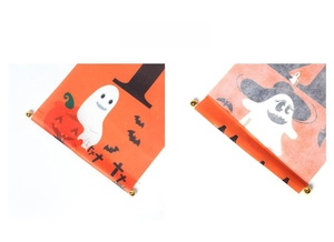 Close-up of Halloween door banners featuring pumpkin and ghost prints with fine sewing details