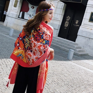 Oversized ethnic style floral scarf in vibrant red color with tassels for beach travel