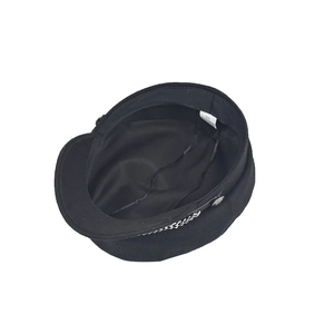 Detail view of black wool baker boy hat with silver metal chain and size 57 inner lining