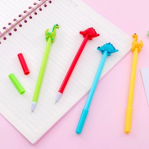 Cute cartoon dinosaur gel pens in four colors on a pink notebook background