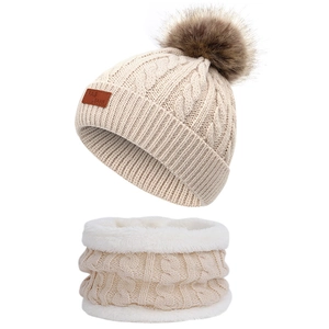 Winter knit hat and scarf set with pom-pom and fleece lining for children in beige color