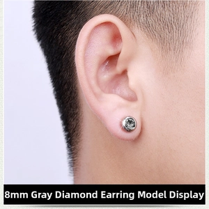 Close-up of a man wearing an 8mm grey crystal magnetic stud earring on earlobe