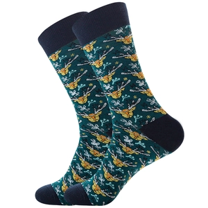Detailed knit pattern of men's cotton socks with festive reindeer and plant motifs