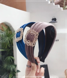 Detail of vintage velvet headbands with sparkling square rhinestones in navy and taupe
