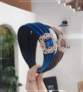 Detail of velvet wide headbands in blue and brown with luxury square crystal buckles
