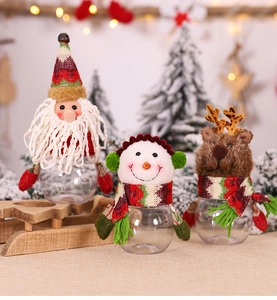 Detailed view of Christmas candy jars featuring Santa, Snowman, and Reindeer soft plush tops