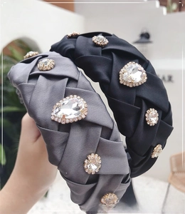 Detail of hand-woven satin headband set with vintage rhinestones in black and grey