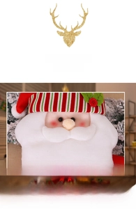 Detailed view of Santa plush ornament with red striped hat and white beard decoration