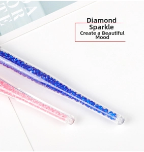 Detail of makeup brush handle filled with sparkling pink and blue crystal diamonds