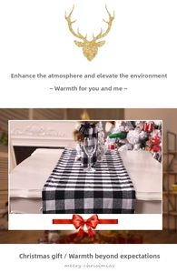 Detail of black and white buffalo plaid table runner on a festive dining setting