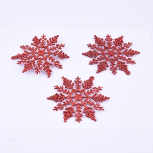 Set of three red glittery plastic snowflake ornaments for Christmas tree and wall decor
