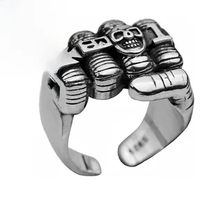 Detailed macro view of S925 sterling silver fist ring with gothic skull and cross motifs
